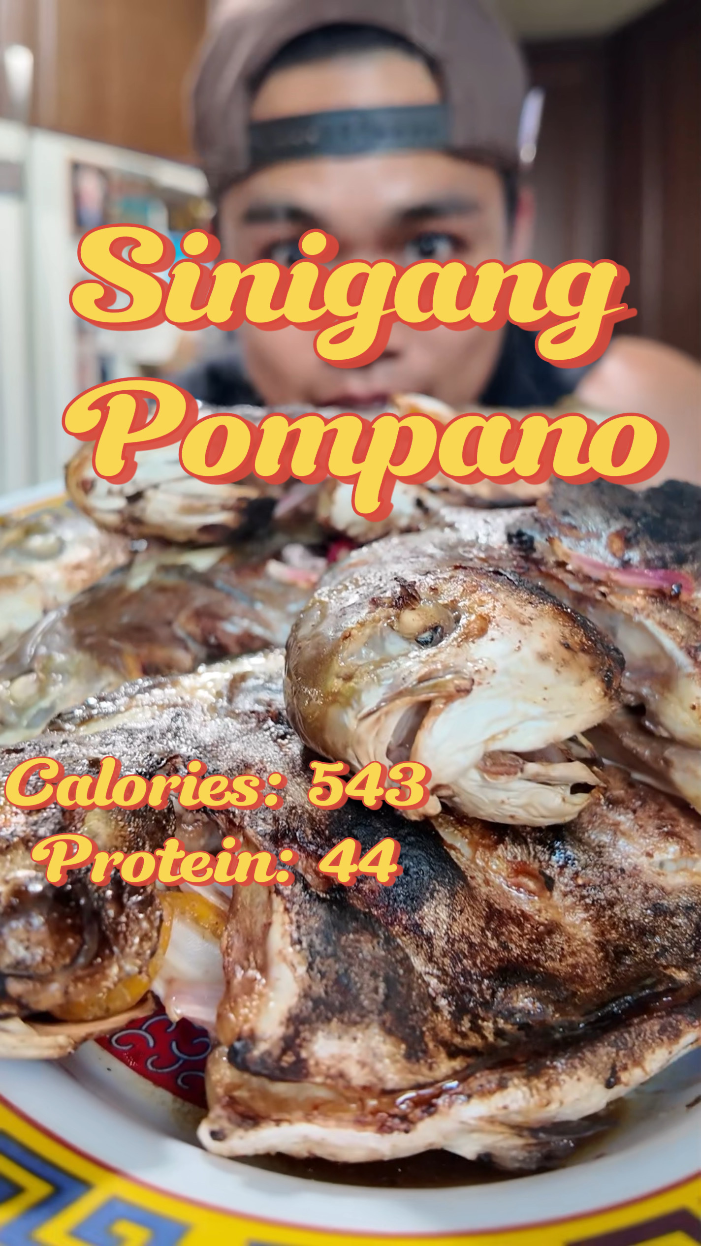 Sinigang Pompano — charred whole fish on a plate
